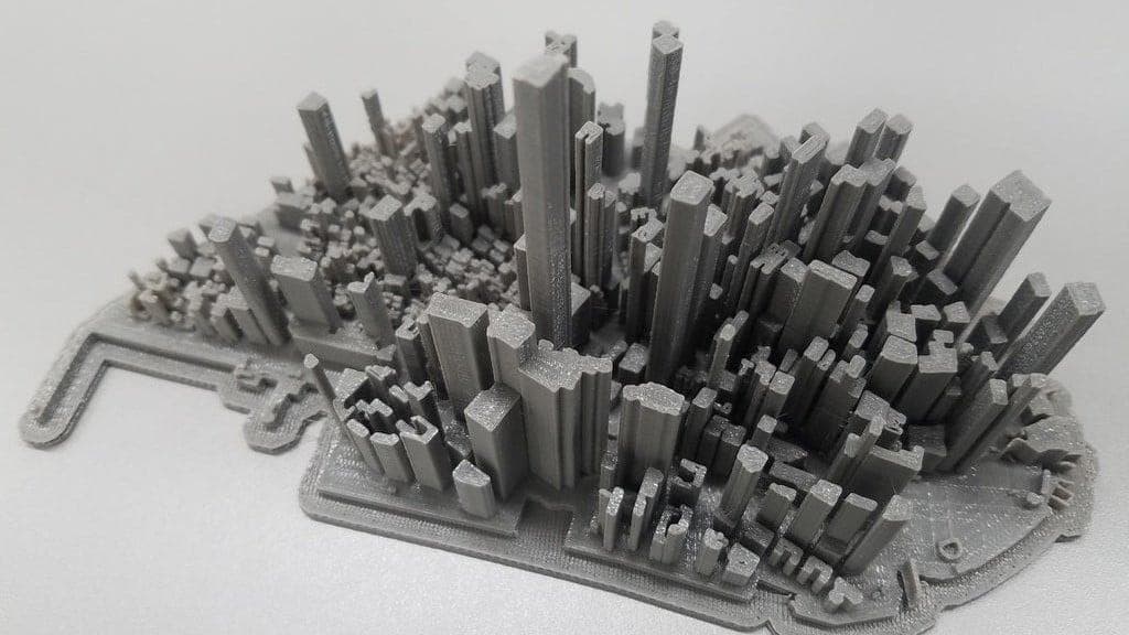 3D city model emerging from a map — architectural precision from real map data